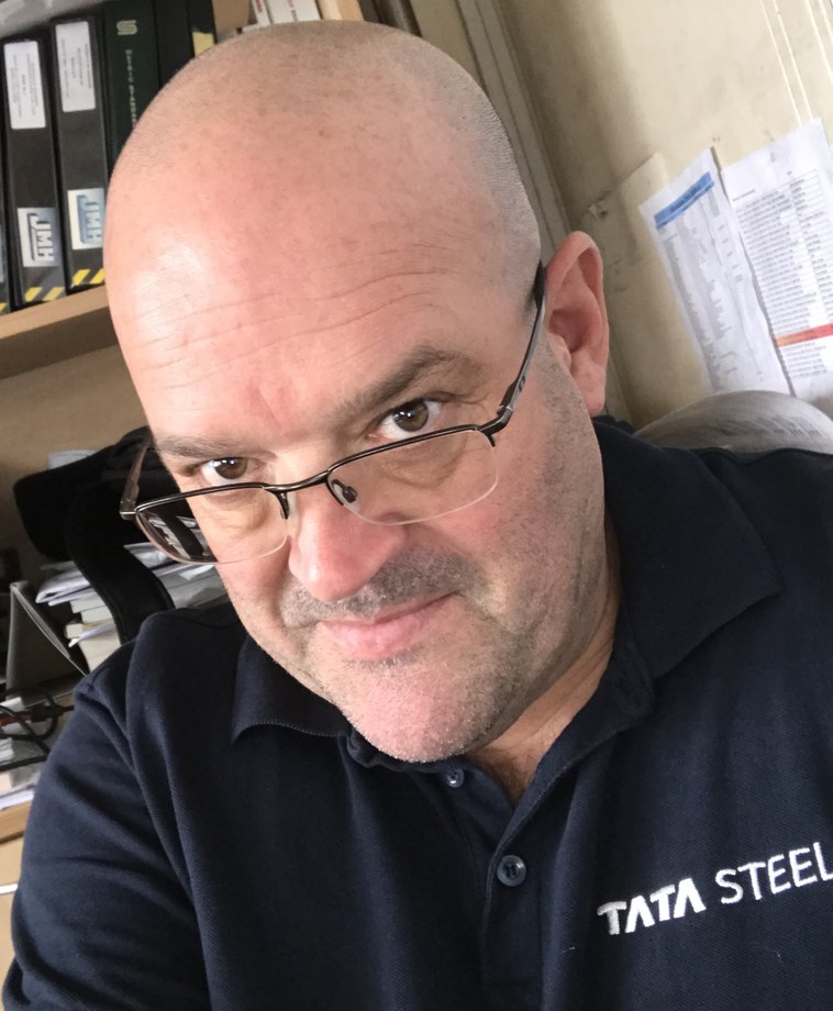 Darren Emery wearing a TATA Steel shirt, founder of SavingEnergy.com.